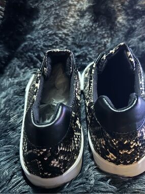 Ladies Black Snake-Print Slip-On Sneakers
